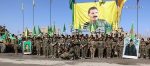 YPJ in Raqqa, Syria, after defeating ISIS there honoring Ocalan's leadership and intellectual contributions. 