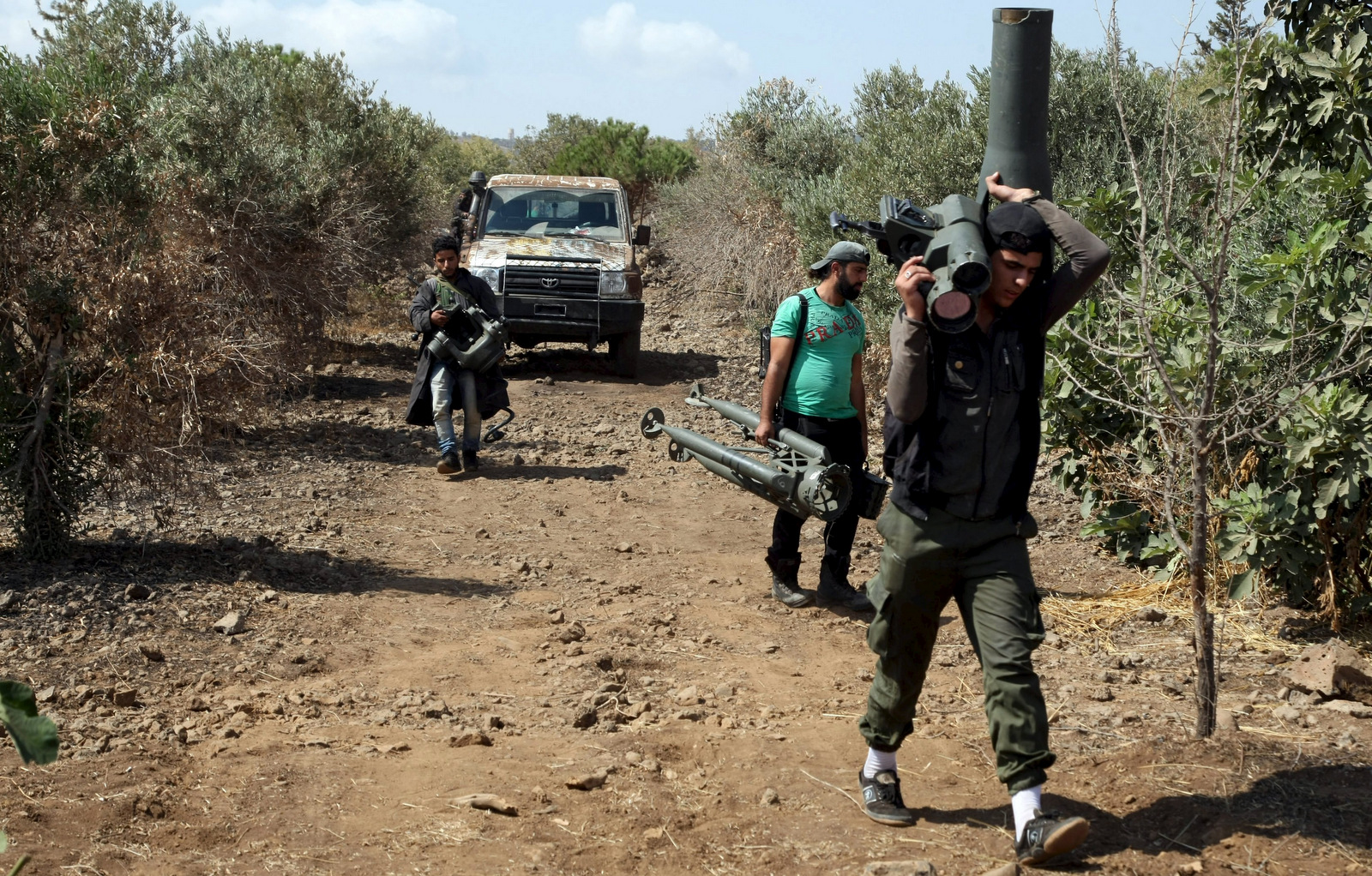 Free Syrian Army fighters carry a weapon during preparations for an operation to strike at forces loyal to Syria's president Bashar Al-Assad in western countryside of Damascus, Syria September 30, 2015. (Alaa Al-Faqir/Reuters)