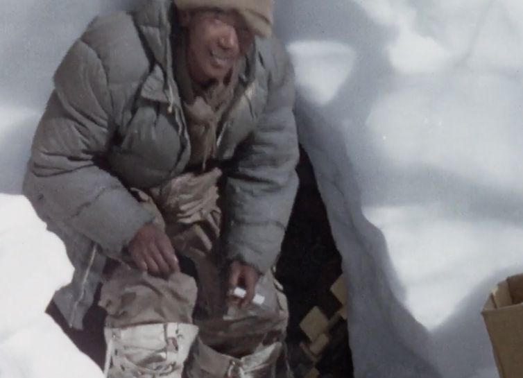 At home in a snow hole. Still from Kangchenjunga 1955. British Film Institute/Royal Geographical Society