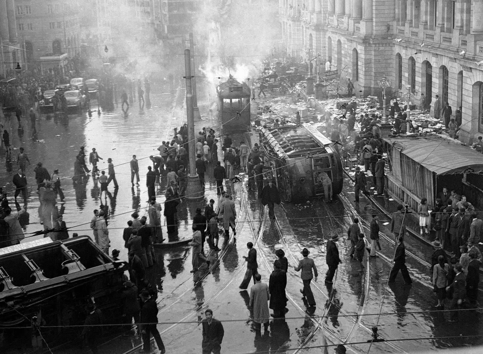 A street car is overturned and burned during an uprising following the assassination of Jorge Eliecer Gaitan in Bogota, Columbia. The 1948 assassination of Gaitan sparked the political bloodletting known as "La Violencia," or "The Violence." (AP/E. L. Almen)
