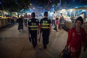 Chinese police patrolling night market near Id Kah Mosque in Kashgar in China's Xinjiang Uighur Autonomous Region, a day before the Eid al-Fitr holiday, June 25, 2017. Courtesy  © 2017 AFP PHOTO, Getty Images 