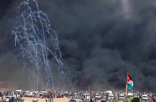 Tear gas and live ammunition fired at Paletinian demonstrators in Gaza in a protest marking al-Quds Day (Jerusalem Day). Click to enlarge