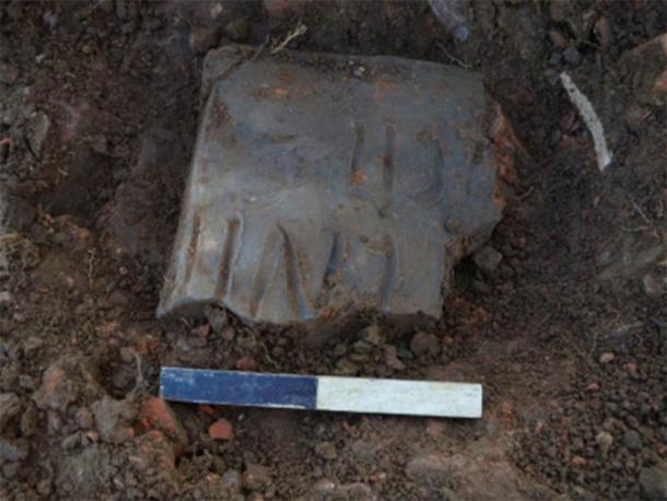 Inscribed tile in-situ: ...ENII (F)ECIT - Perhaps '()nenti' or '()nenus' FECIT = 'has made' – so perhaps the name of the tiler. (Oxford Archaeology East)
