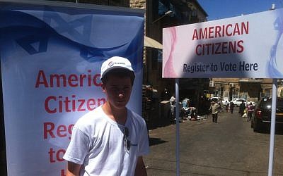 A volunteer signing up US citizens to vote on the streets of Jerusalem (photo credit: courtesy Elie Pieprz)