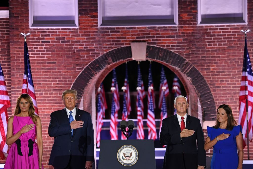 (From L) US First Lady Melania Trump, US President Donald Trump, US Vice President Mike Pence and Second Lady Karen Pence listen to the US National Anthem, "the Star-Spangled Banner", during the third night of the Republican National Convention at Fort McHenry National Monument in Baltimore, Maryland, August 26, 2020. (Photo by SAUL LOEB / AFP) (Photo by SAUL LOEB/AFP via Getty Images)