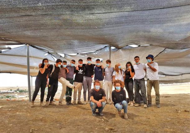A few of the volunteers that worked at the excavation site of the oldest soap factory in the world in Rahat, Israel (Emil Aladjem/Israel Antiquities Authority)