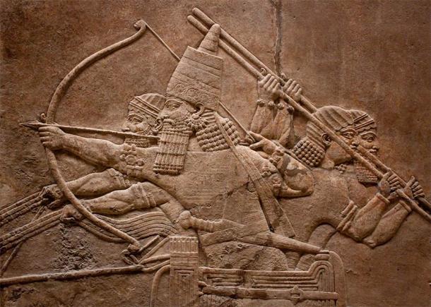 Ancient relief of Assyrian warriors fighting in the war (kmiragaya / Adobe Stock)