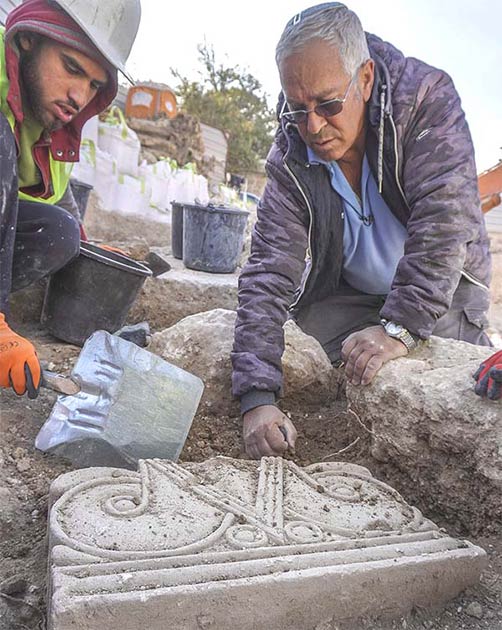 The uncovering of the capitals as they were found in the ground at the Jerusalem excavation site. (Shai Halevi / Israel Antiquities Authority)