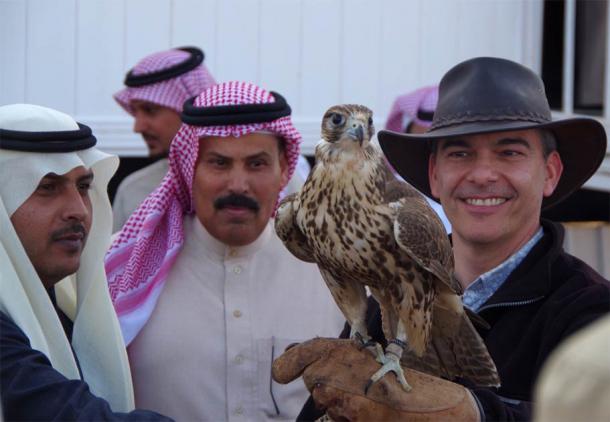 Professor Michael Petraglia, the research study's senior author, of the Max Planck Institute for the Science of Human History, taking a break with an iconic falcon in Saudi Arabia. (Conversations in Human Evolution)