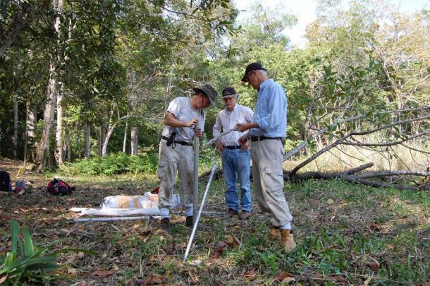UC researchers Nicholas Dunning, left, Vernon Scarborough and David Lentz set up equipment to take sediment samples during their field research at Tikal. (Liwy Grazioso Sierra)
