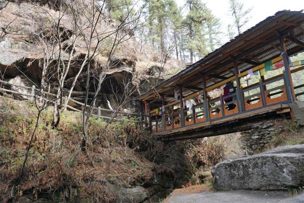 An ancient bridge that crosses over the gorge at Bhutan's Burning Lake. (David / Adobe Stock)