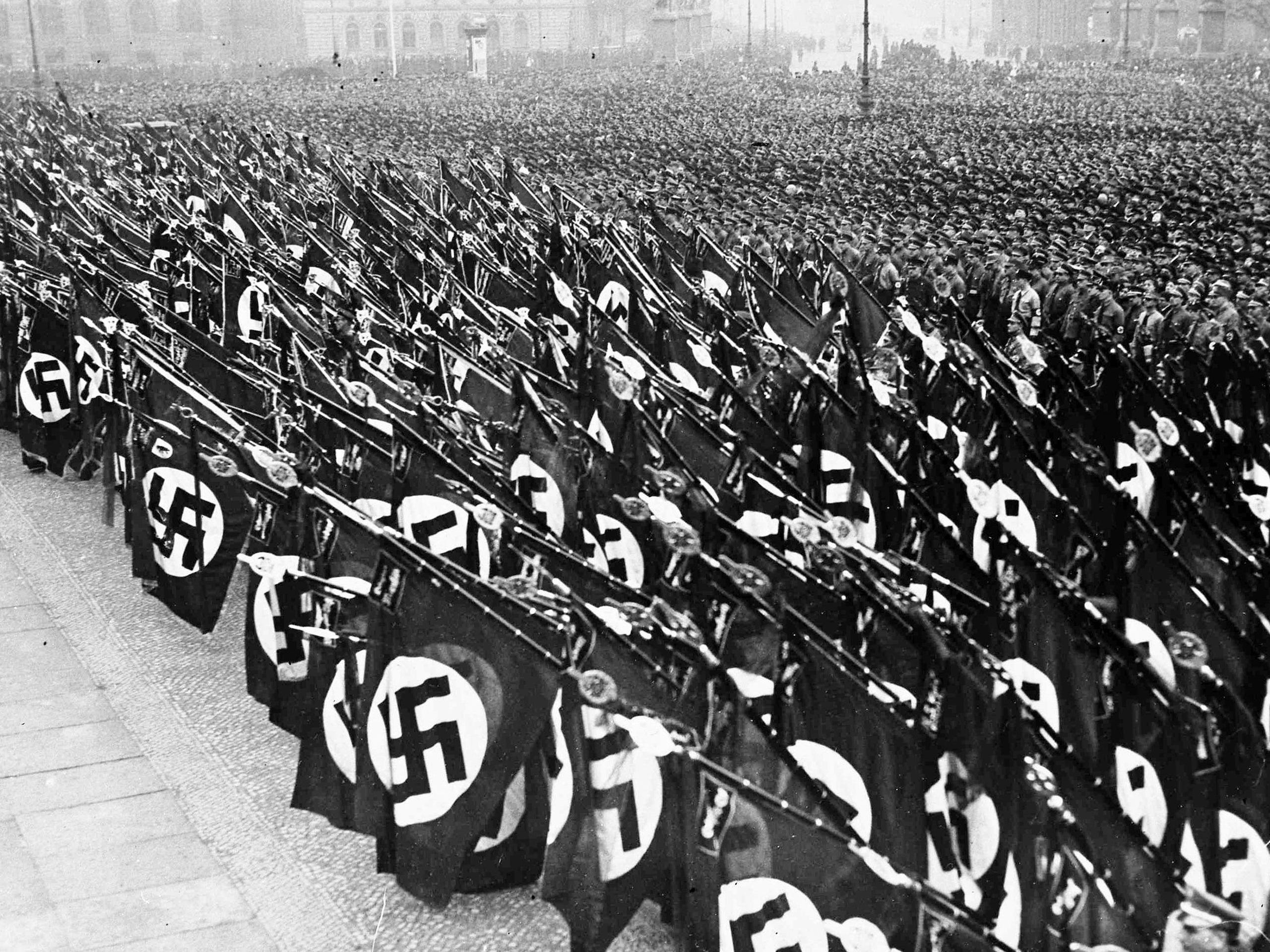 Tens of thousands of Nazi storm troopers take the oath of allegiance to Chancellor Adolf Hitler, in the Lustgarten, Berlin, Feb. 26, 1934. Nazi banners are dipped during the swearing of the oath.