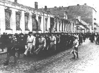 Jewish police of the Warsaw ghetto pass in review