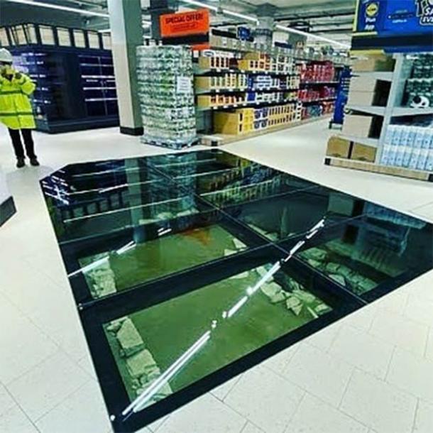 The completed glass floor and the Hiberno-Norse structure underneath in the new Lidl supermarket in central Dublin, Ireland designed by the Irish Archaeological Consultancy Ltd. (Andrew Finney)