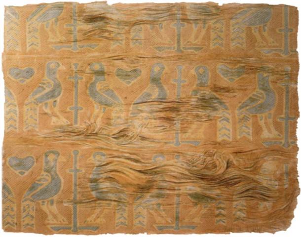 The motive on this Viking burial textile, a pillow, found in one of the reliquaries in Denmark shows birds, probably peacocks, flanking a stylized tree or cross. It consists of several silk pieces sewn together. Source: The National Museum of Denmark