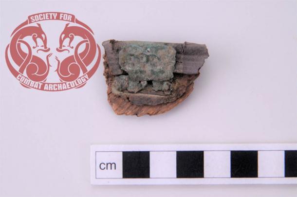 A well-preserved fragment from the edge of a Viking Age shield was excavated from a grave in Birka (Sweden). The fragment consists of a wooden core which is reinforced with tanned sheep skin (leather) on both sides and an additional layer of tanned cattle skin (leather) around the edge. (Rolf Warming / Society for Combat Archaeology)