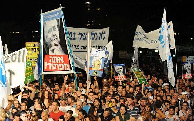 'The people demand social justice' was a catchphrase of the social protests that erupted around the country in the summer of 2011. The Trajtenberg Committee was established following the protests. (photo credit: David Katz/The Israel Project)
