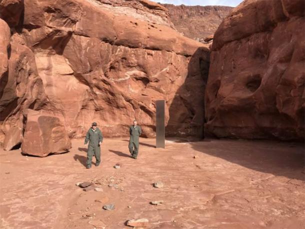 Utah officials walking away from the bizarre metal monolith. (Utah Department of Public Safety)