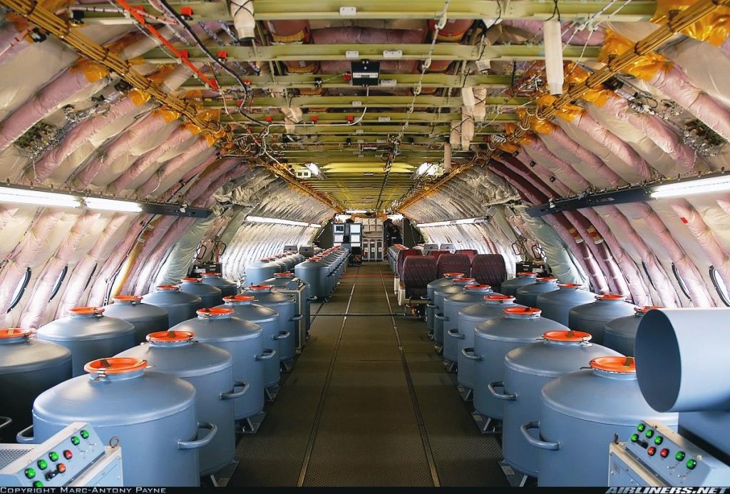 Many vats of something inside a very large plane