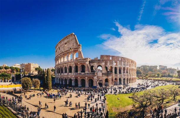 Tourists at the Colosseum. (Calin Stan /Adobe Stock)