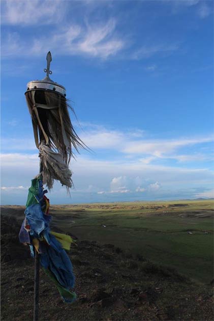 A horse-hair banner adorns a hillside monument in central Bayankhongor province, Mongolia. (William Taylor)