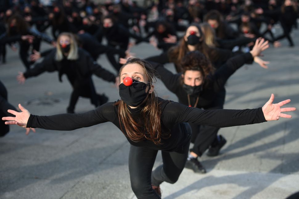 One hundred eighty performers from the group "Les Essentiels" dance on Dec. 12 in Montpellier to protest against the governme