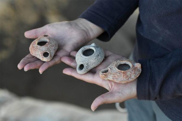 The stash of ancient clay oil lamps were found next to a buried water cistern, which led experts to believe this could be the location of the lost Beit Natiff lamps. (Israel Antiquities Authority)