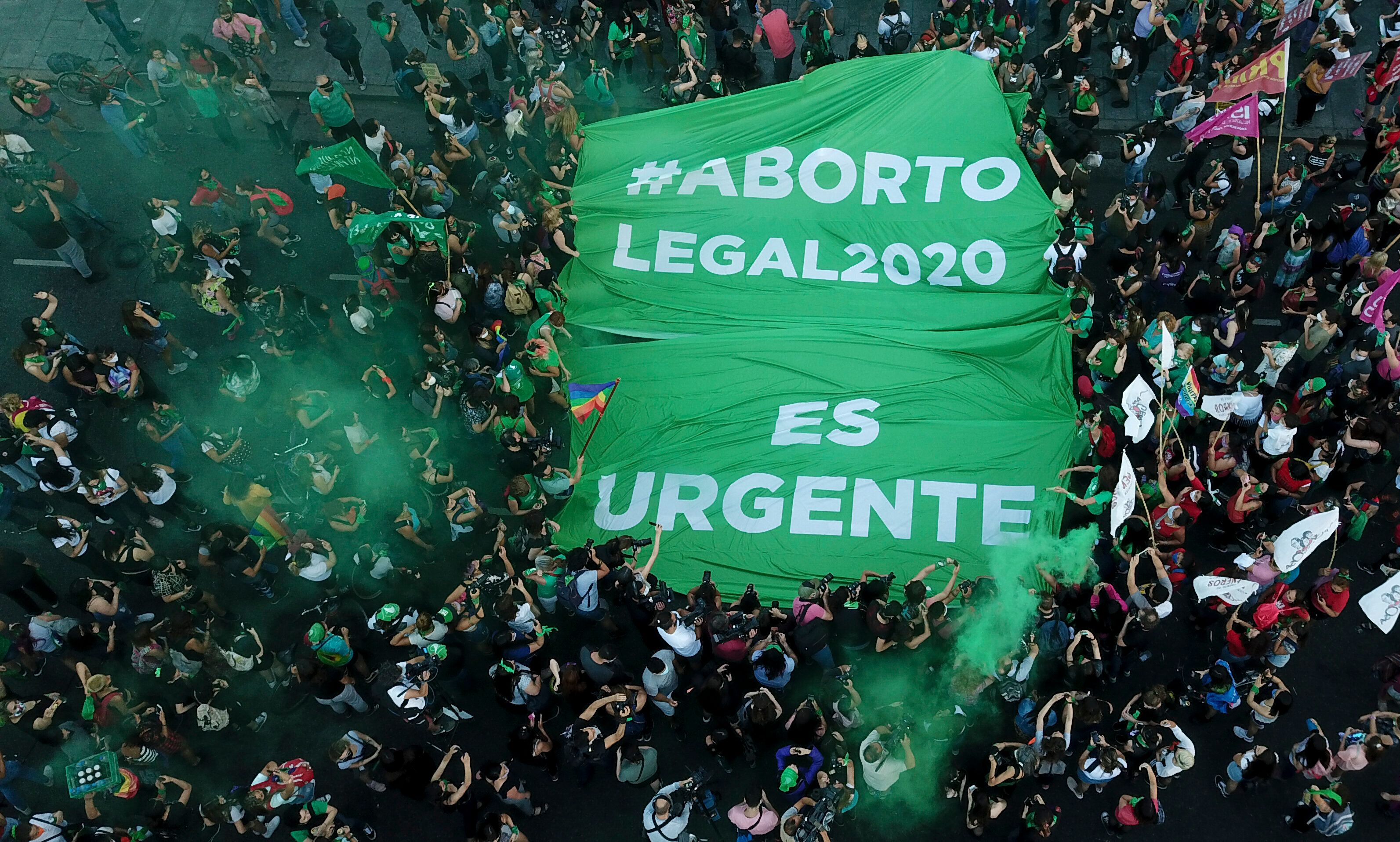 Abortion-rights activists in Argentina demonstrate in favor of decriminalizing abortion with a banner that reads in Spanish "