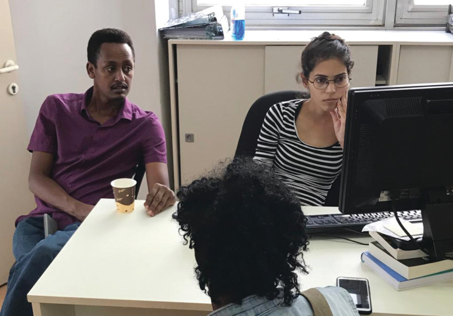 African migrant activist Ghere Meles (left, at the hotline) (COURTESY - HOTLINE FOR REFUGEES AND MIGRANTS)