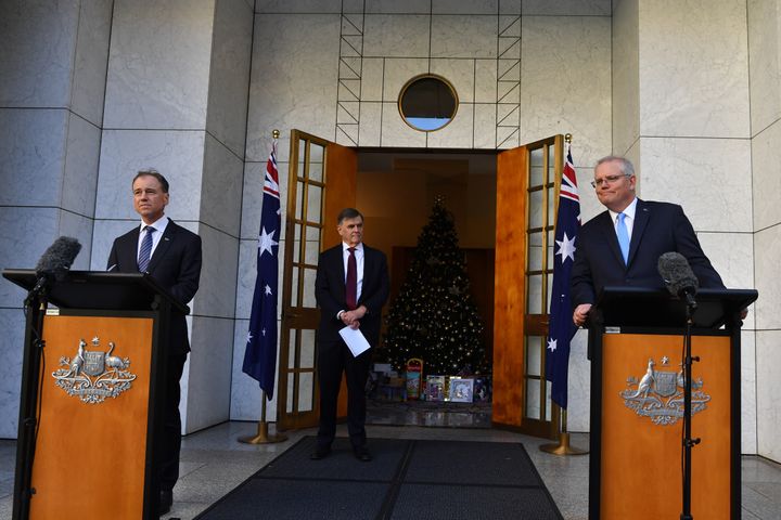Australia's Minister for Health Greg Hunt (left), Prime Minister Scott Morrison (right) and Australia's Chief Medical Officer