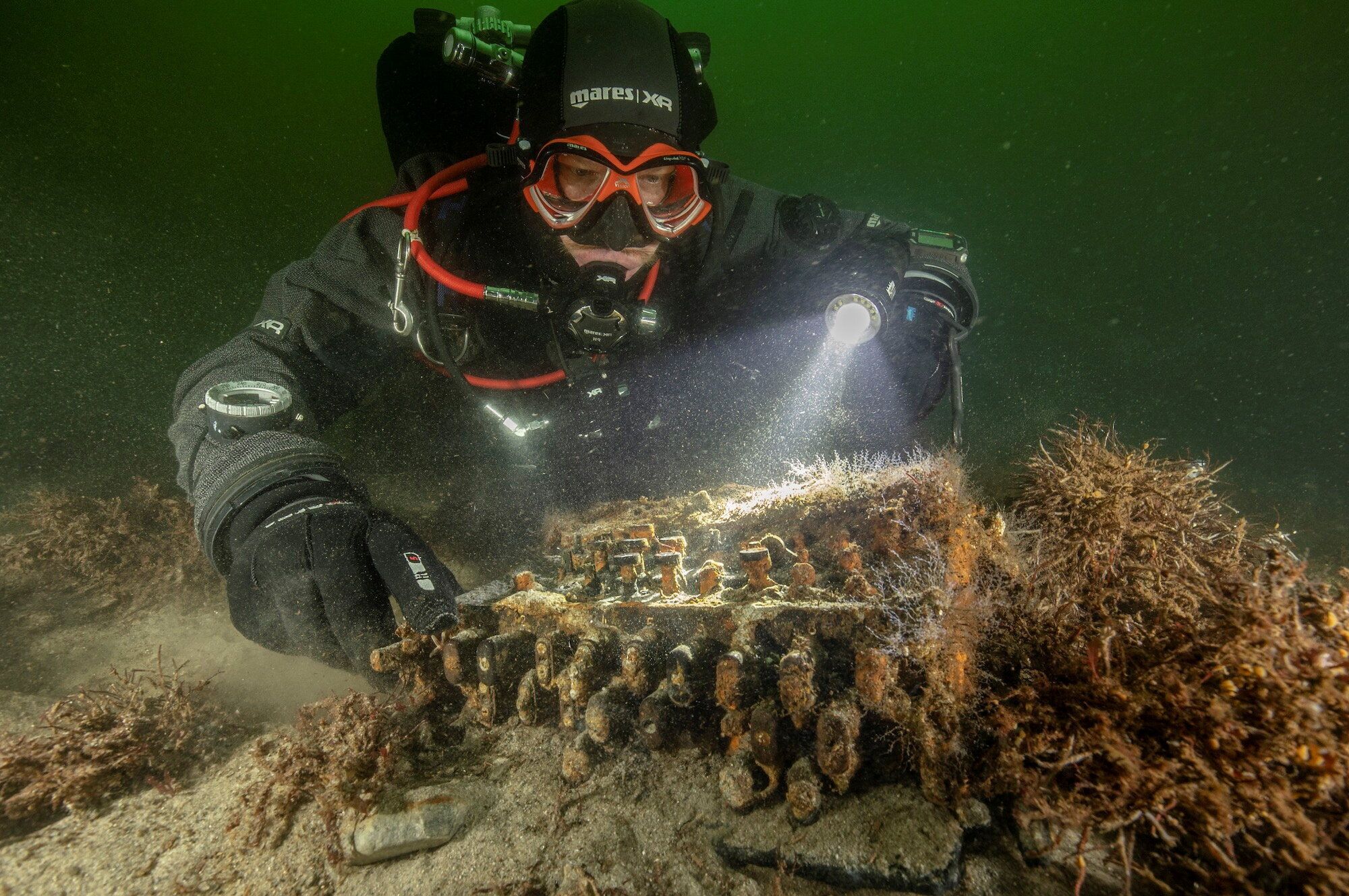 German divers searching the Baltic Sea for discarded fishing nets have stumbled upon a rare Enigma cipher machine used by the