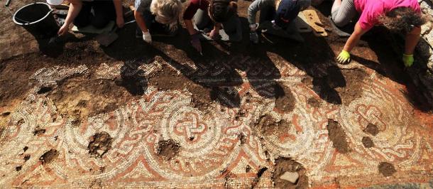 A group effort in the process of restoring the Chedworth Roman villa floor mosaic. (National Trust)