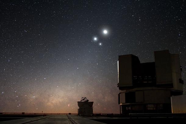 View of the night sky over ESO's Very Large Telescope (VLT) observatory at Paranal, Chile, showing the Moon, Jupiter and Venus, during a planetary conjunction. While it appears they are colliding, these planets are actually millions of kilometers apart. (ESO / Y. Beletsky)