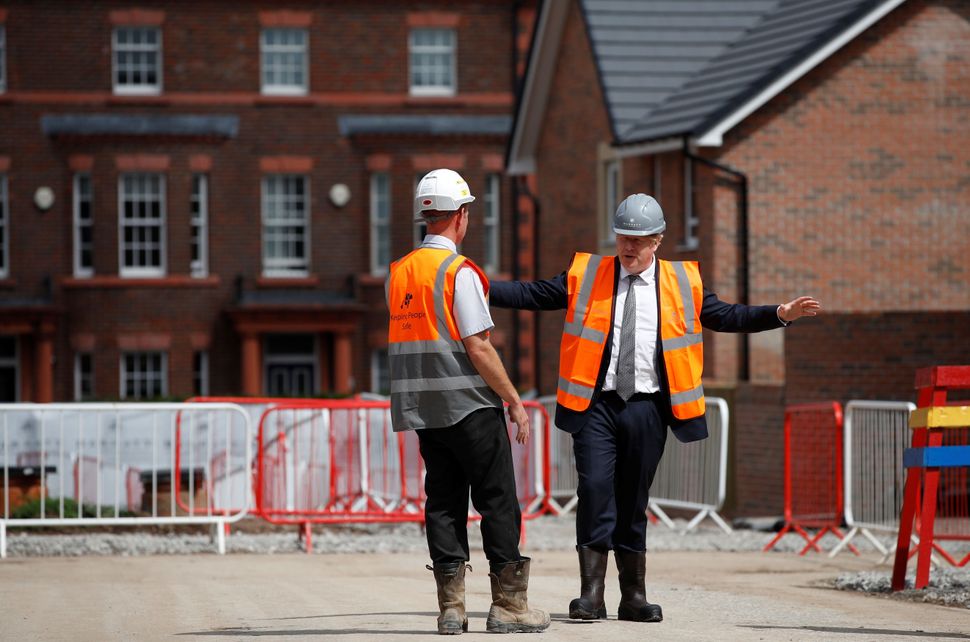 Prime minister Boris Johnson visits a construction site in Warrington in August. The government has been slammed for failing 