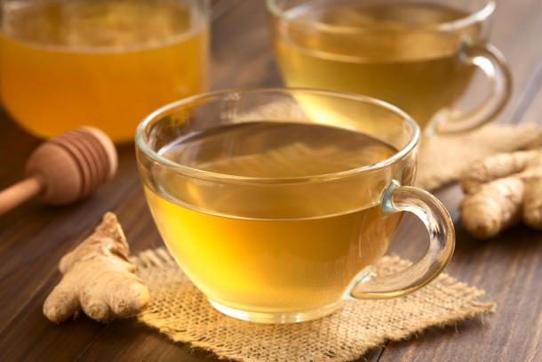 Ginger, lemon and honey tea is recommended in Ayurvedic medicine to sooth sore throats and suppress dry coughs. (Ildi / Adobe Stock)