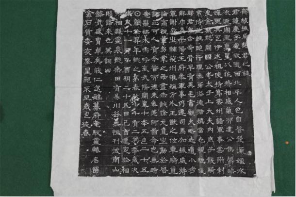 Amongst the remains found in the Chinese tomb was a fully legible epigraph. The ancient epigraph offers a written history of the life of the two occupants of the tomb, a couple by the name Qu Qing. (Zhou HuiYing / China Daily)