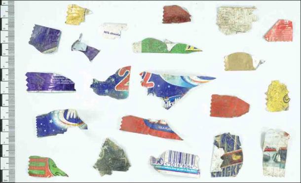 Examples of the small fragments of sweet wrappers recovered from the Earthwatch roundhouse at Castell Henllys. (A. Fairley Antiquity/Antiquity Publications Ltd)