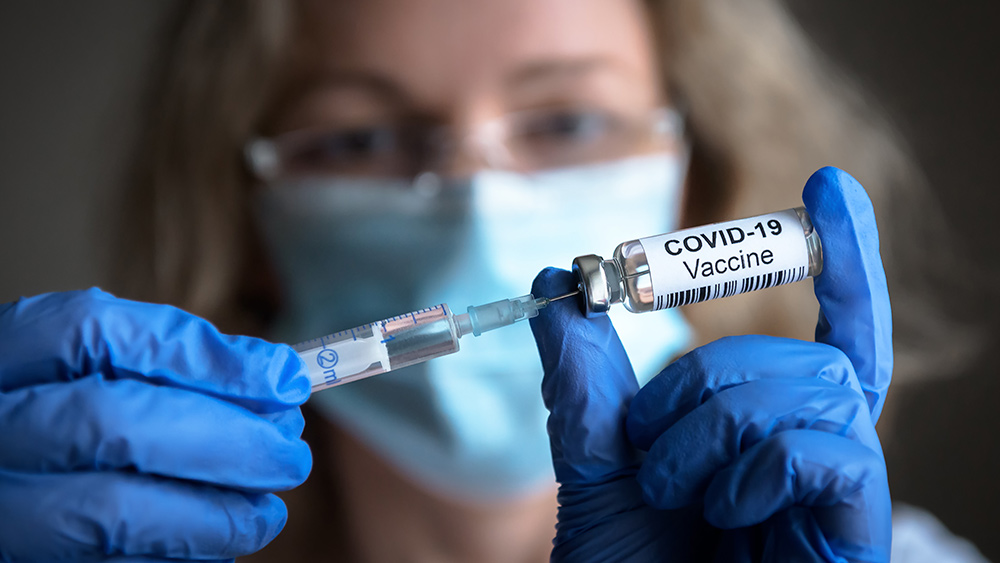 Covid-19-Coronavirus-Nurse-Vaccine-Syringe-Vial.jpg