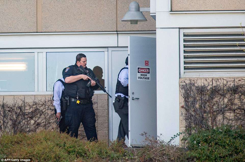 Police search a building at YouTube's corporate headquarters as an active shooter situation was underway in San Bruno on Tuesday