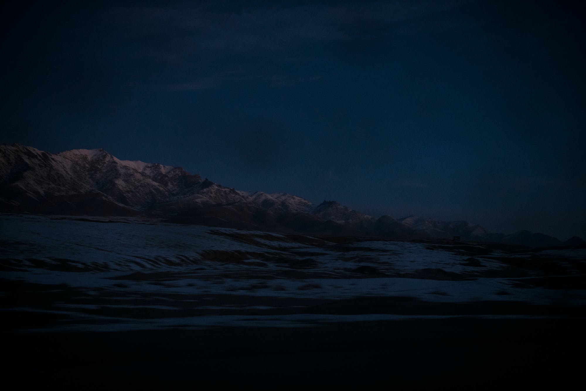 Mountains covered in this winter’s first snow in Wardak province, as seen from the Kabul-Kandahar Highway where it passes through Sayedabad district, at dawn.