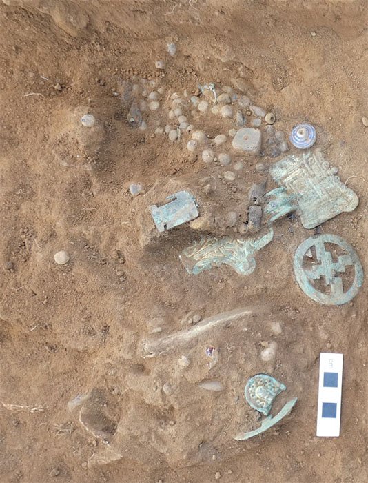 Beads and brooches found in one of the Overstone site graves. (MOLA)