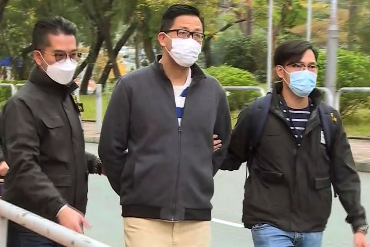 In this image taken from a video, Hong Kong's Democratic Party member and former lawmaker Lam Cheuk-ting, center, is arrested