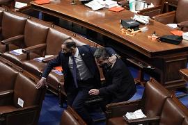 Lawmakers evacuate the floor as protesters were about to break into the House Chamber at the U.S. Capitol in Washington. January 6, 2021