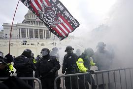 Police hold off Trump supporters who tried to break through a police barrier at the Capitol in Washington, USA. January 6, 2021
