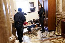 U.S. Capitol Police hold protesters at gun-point near the House Chamber inside the U.S. Capitol in Washington. January 6, 2021