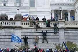 Supporters of President Donald Trump climb the west wall of the the U.S. Capitol in Washington, USA. January 6, 2021