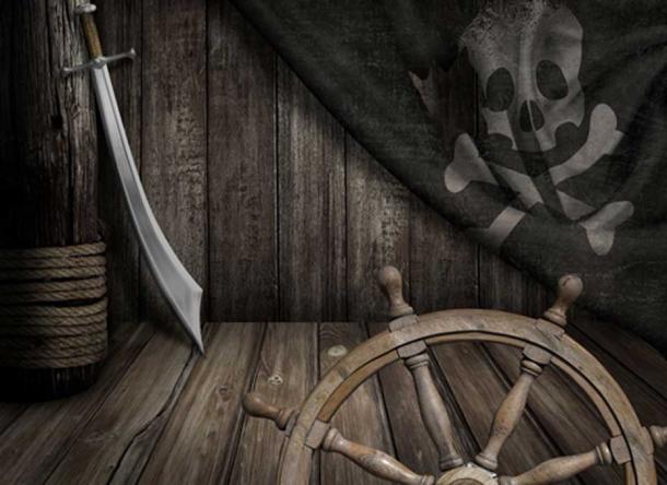 Pirates ship steering wheel with old jolly roger flag and saber (Andrey Kuzmin / Fotolia)