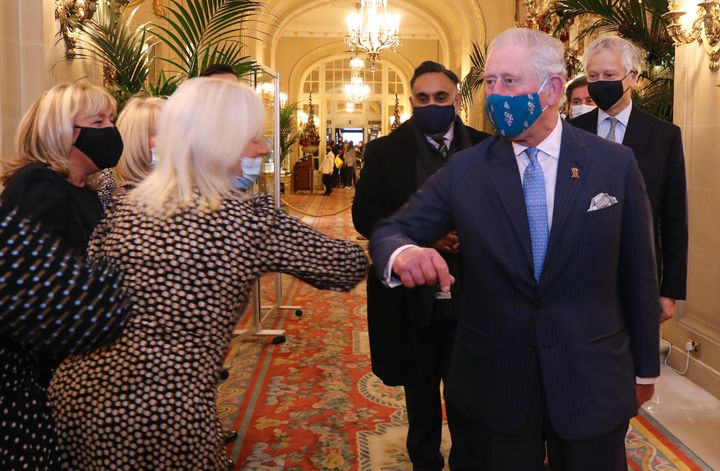 Prince Charles greets staff during a visit to The Ritz London in support of the hospitality sector on Dec. 10.