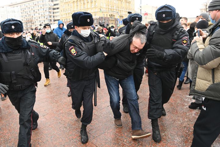 Police detain a man prior to an expected rally in support of jailed opposition leader Alexei Navalny in Moscow on Saturday.