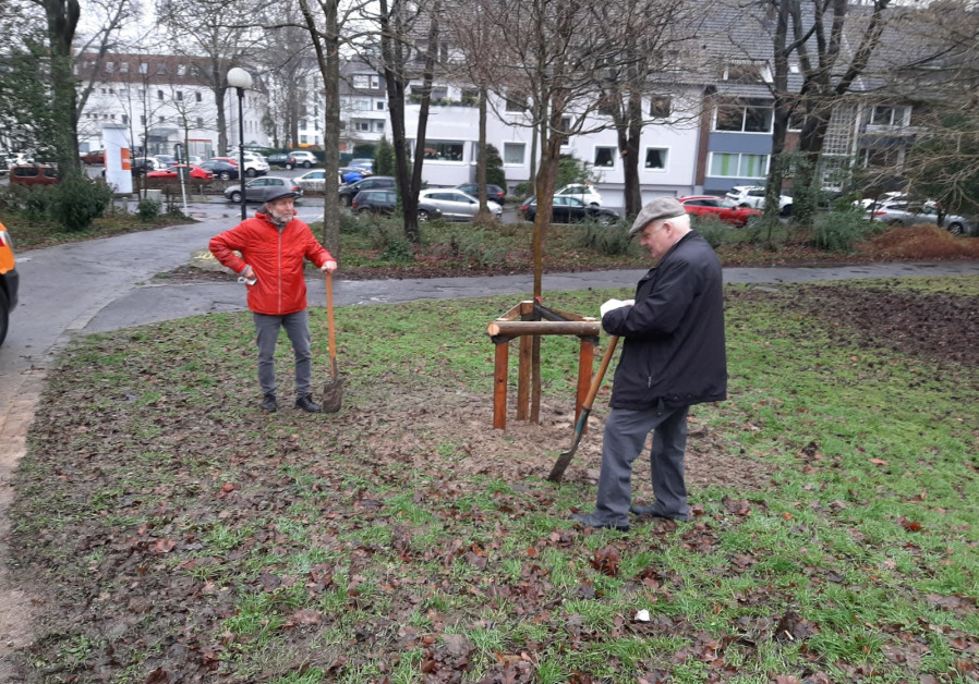 Dortmund's mayor Norbert Schilf (R) and Tzvi Rappaport (L) planting the symbolic six trees, January 28, 2021. (Credit: WORLD BNEI AKIVA)